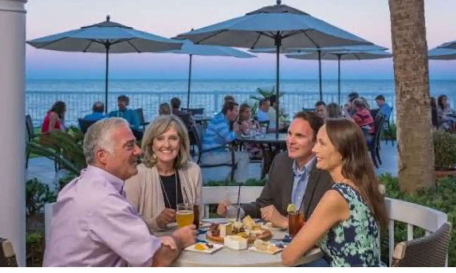 People eating at coastal restaurant